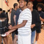 Athletes enjoying dessert after the banquet. -Don Miller Photography