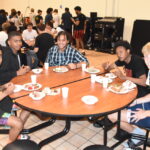 Athletes from Detroit and Louisville dine with athletes from Northern Michigan. -Don Miller Photography